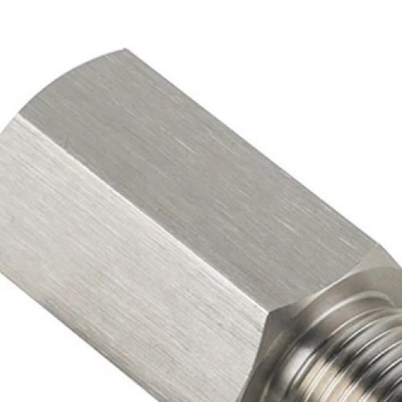 Close-up of the brushed stainless steel hex body of the spacer